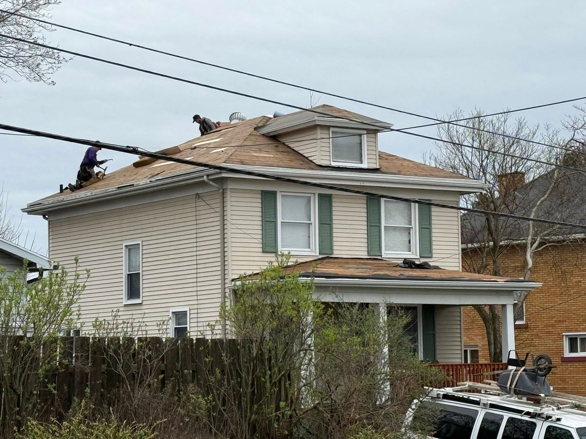 A house with a roof that is being repaired.