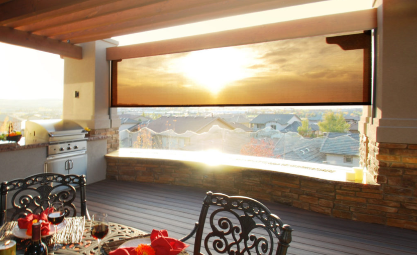 A wood pergola with a retractable canopy from Sunesta in the open position