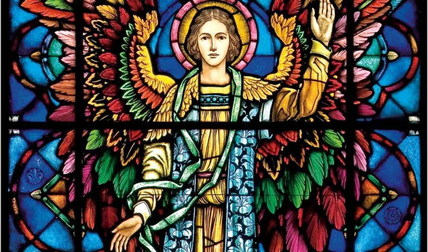 A stained glass window of a woman with wings