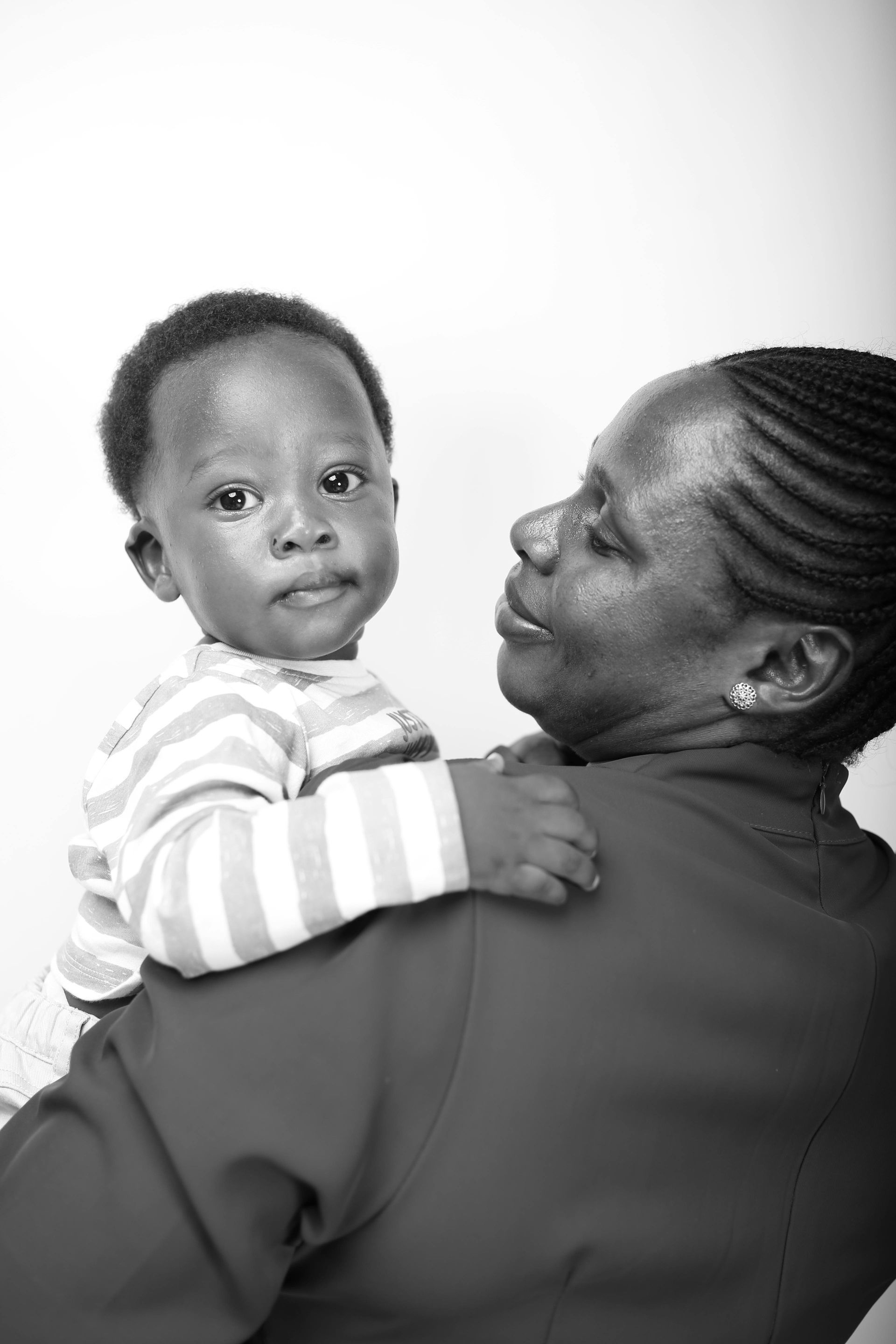 mother holding baby childcare support Trinidad family care
