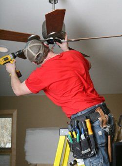 Worker-installing-ceiling-fan - Electrical Services in Glenville, PA
