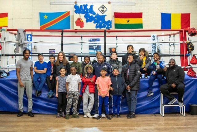 Selby Amateur Boxing Club kids beside a boxing ring