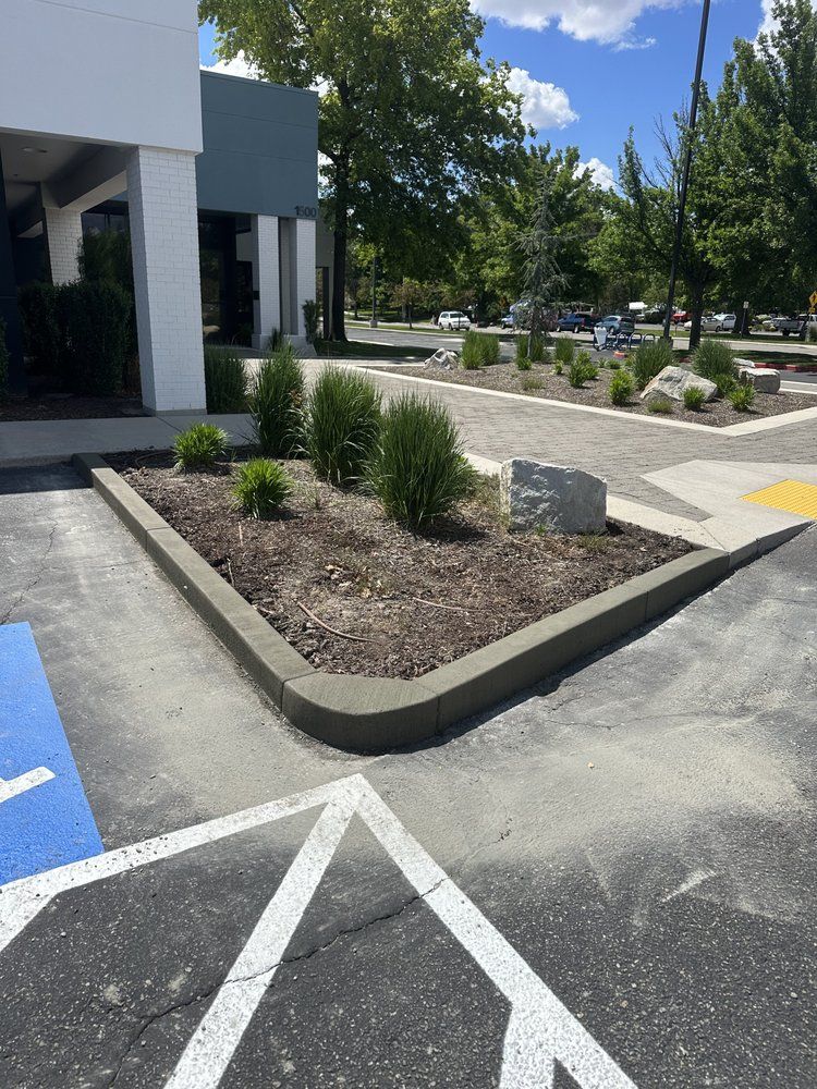 A parking lot with a handicapped parking spot in front of a building.