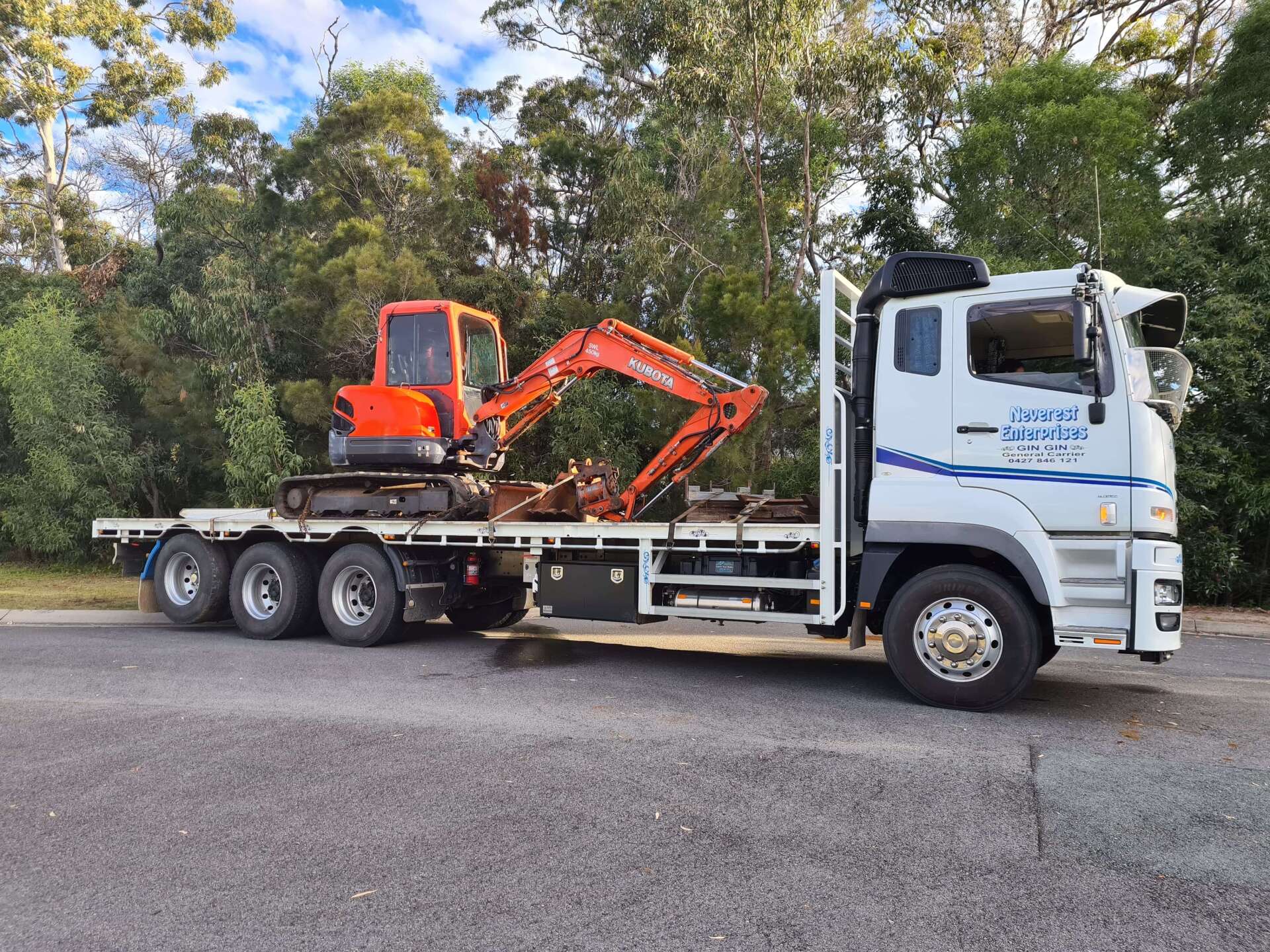 Red Tractor on Truck — Deliveries in Gin Gin, QLD
