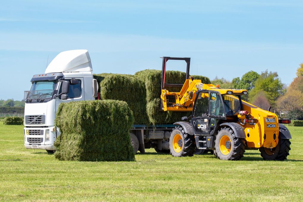 Truck Loading Up with Fresh Hay Bales — Deliveries in Gin Gin, QLD
