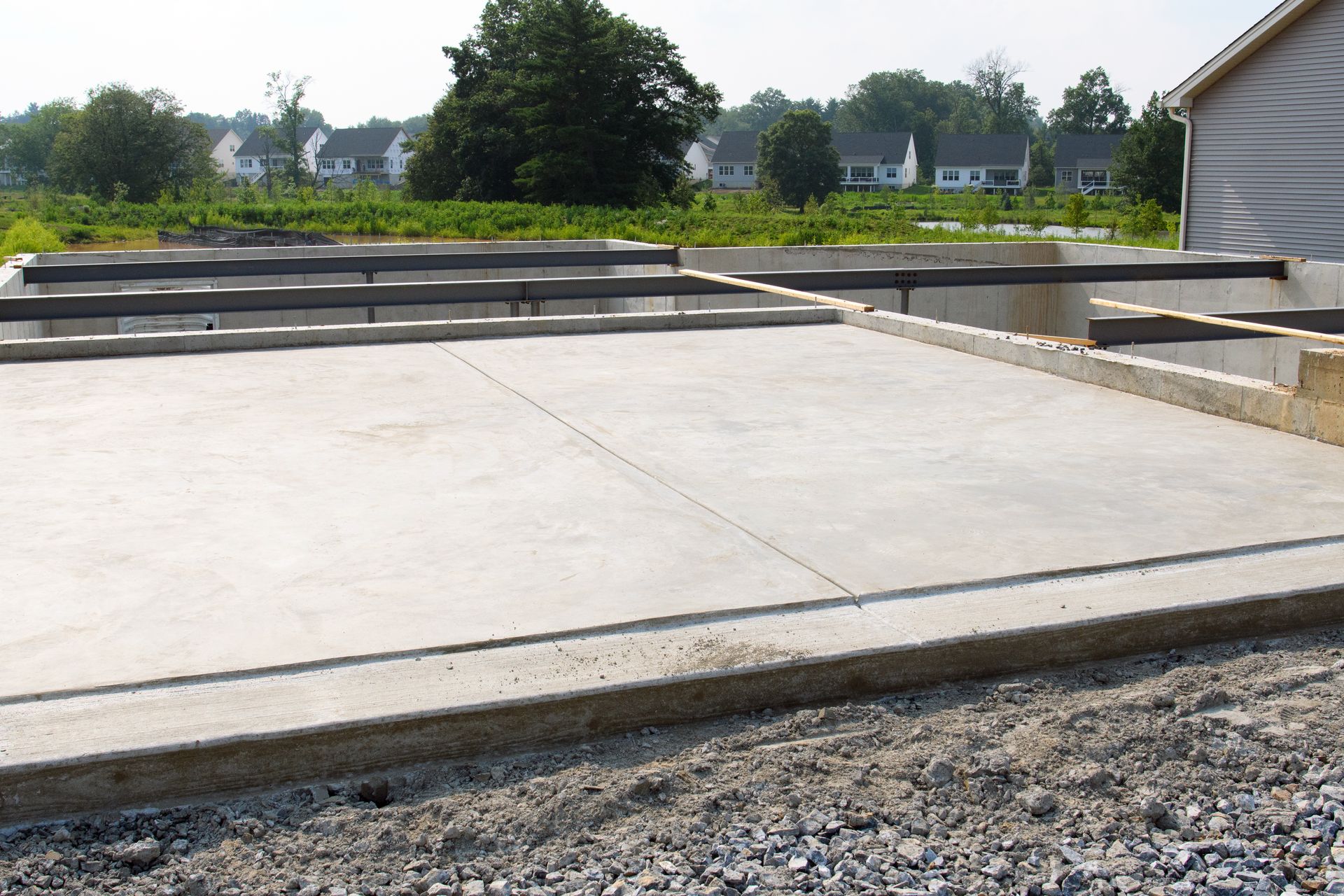 freshly poured concrete foundation in building a new house