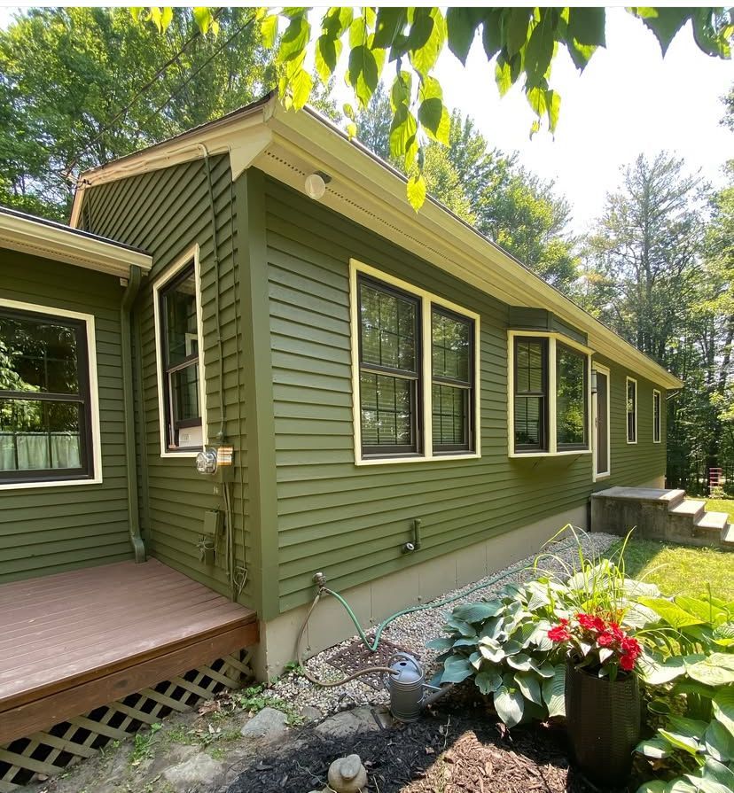 An empty dining room with hardwood floors and a window. An empty dining room with hardwood floors and a window.