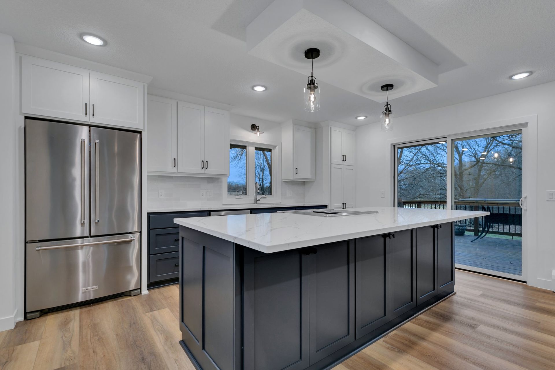 There is a large island in the middle of the kitchen.