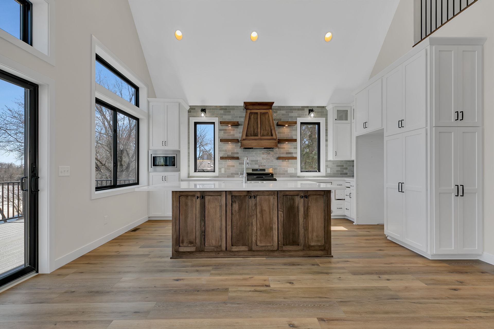 A kitchen with a large island in the middle of the room.