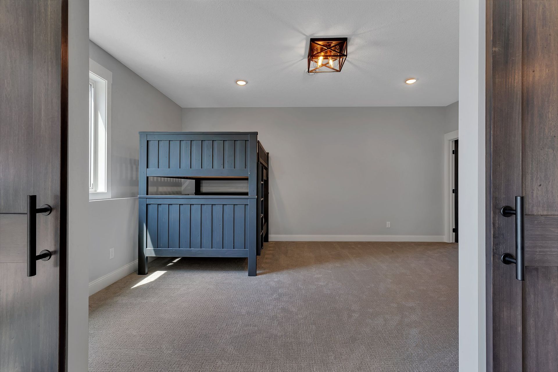 There is a bunk bed in the middle of the room.