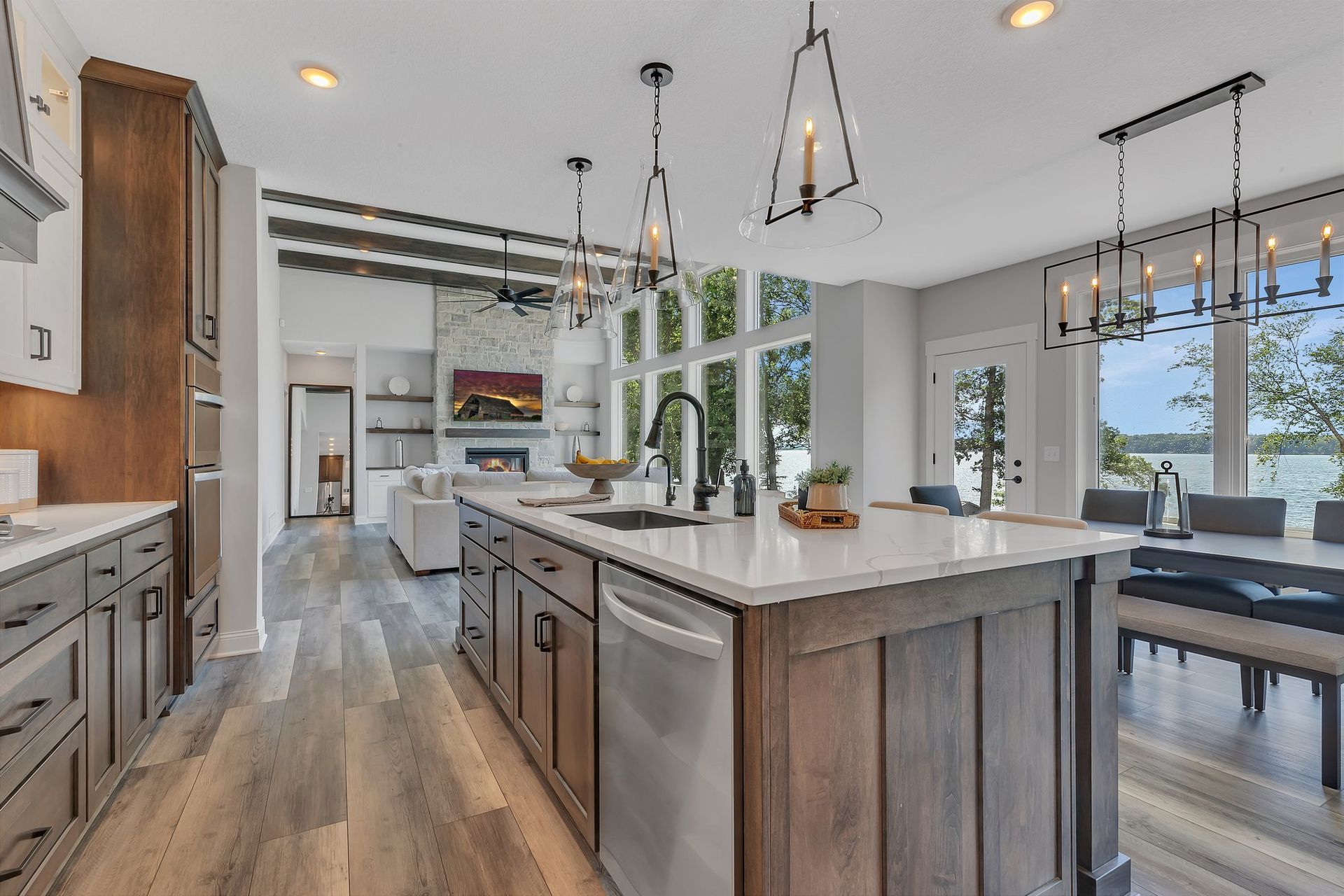 A kitchen with a large island and stainless steel appliances.
