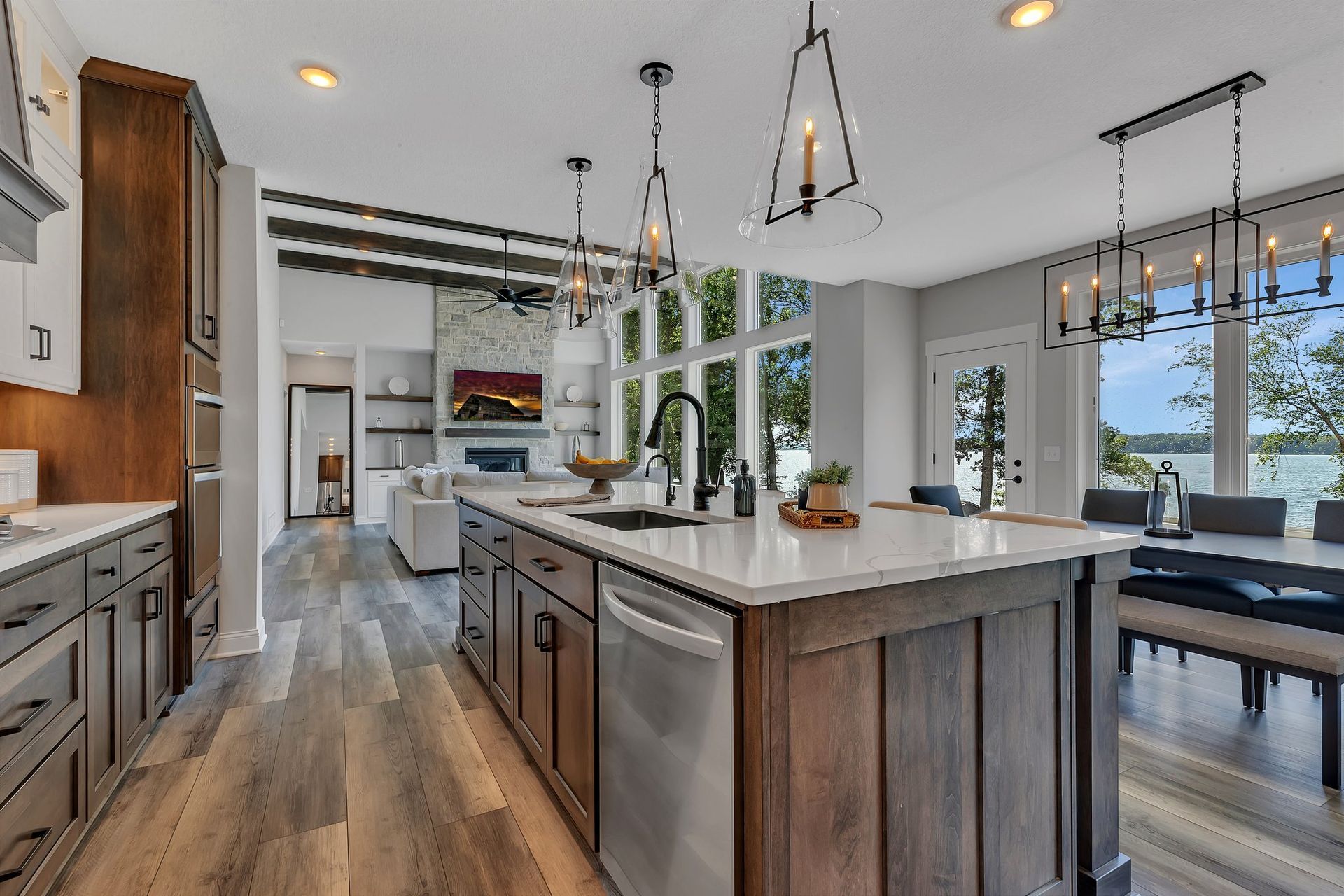 A kitchen with a large island and stainless steel appliances.