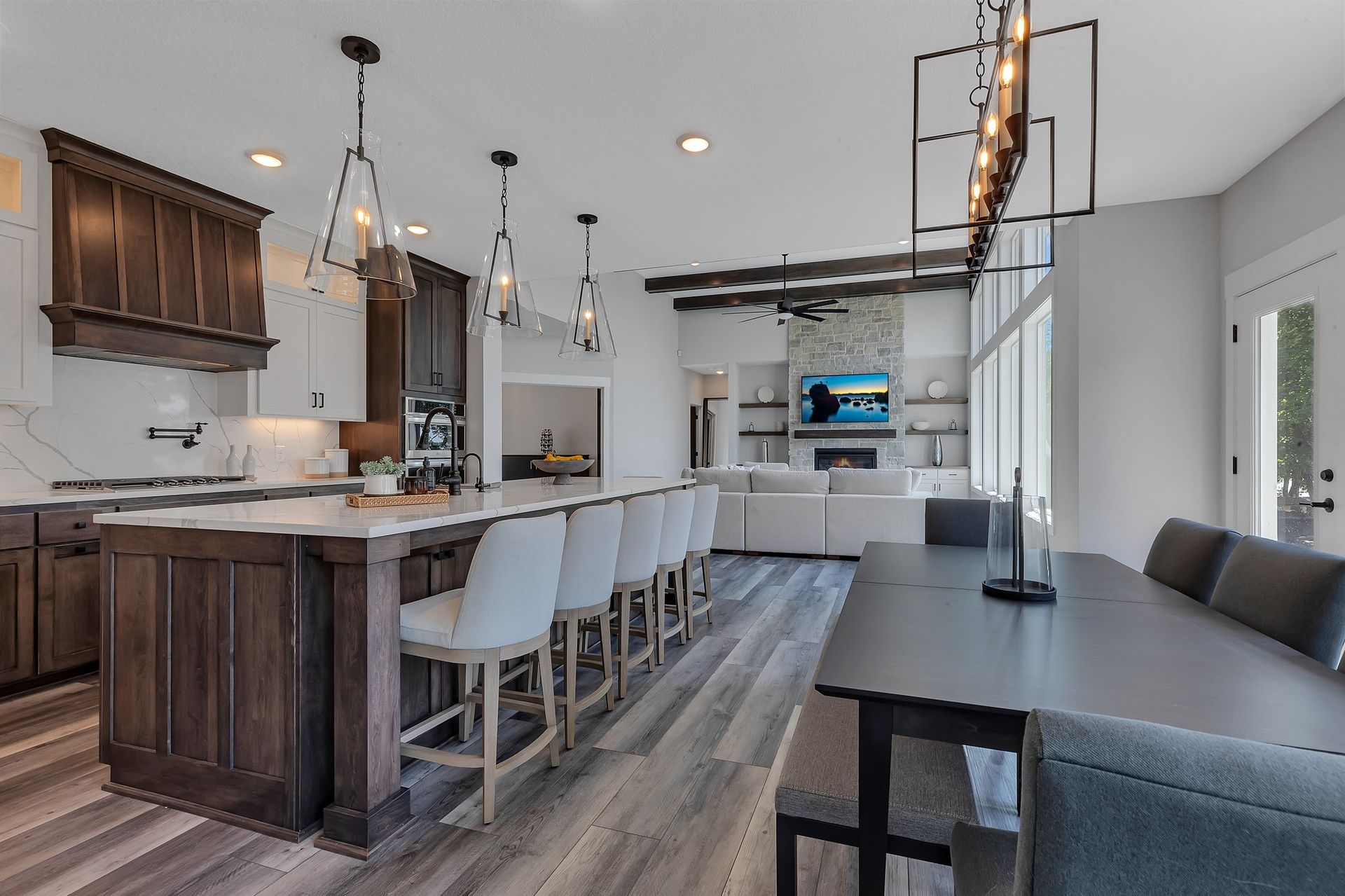 A kitchen with a large island and a dining table