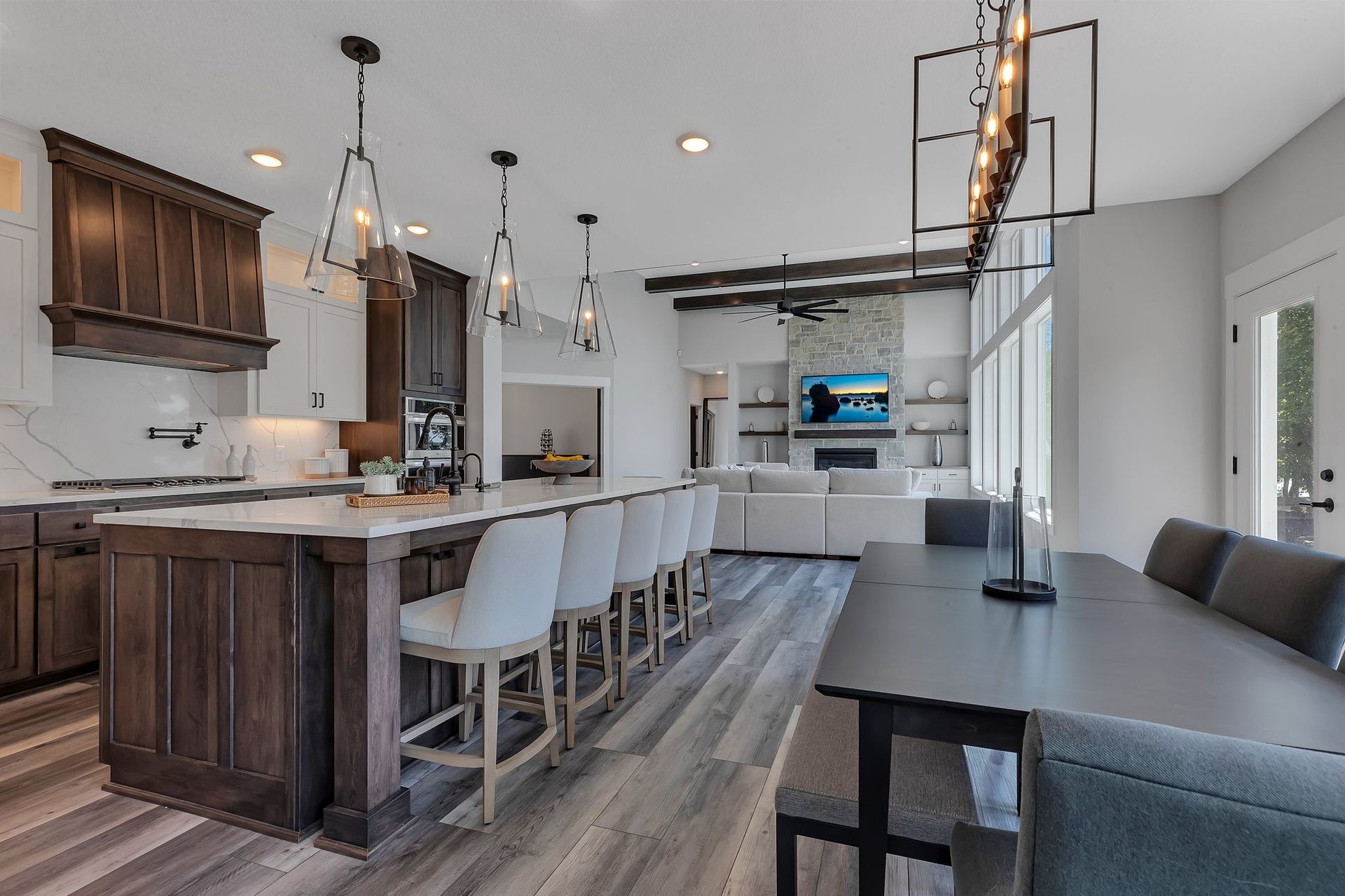 A kitchen with a large island and a dining table