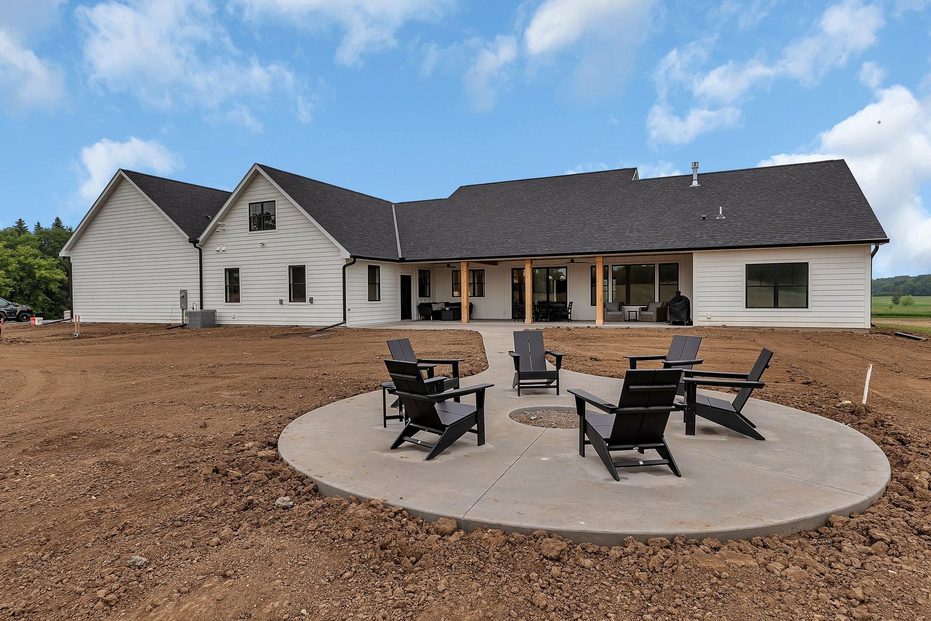 A house with a fire pit in front of it