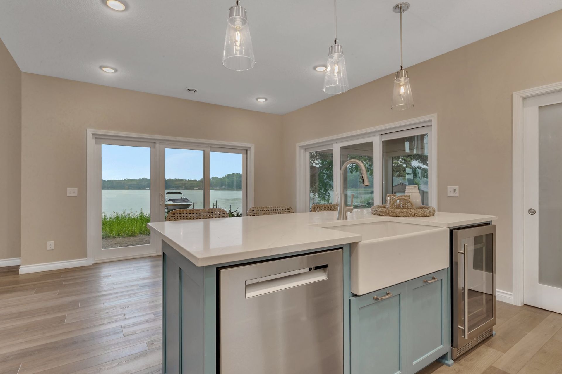 A kitchen with a large island and stainless steel appliances.