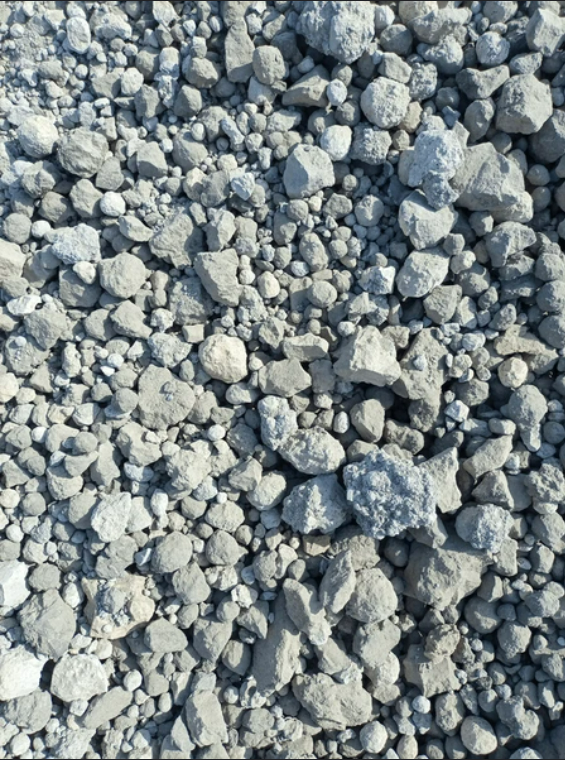 A pile of rocks is sitting on the ground.