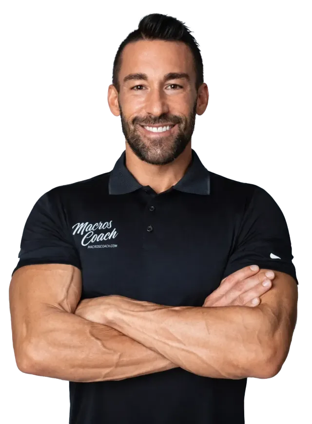 Man with crossed arms wearing a black polo shirt, smiling.