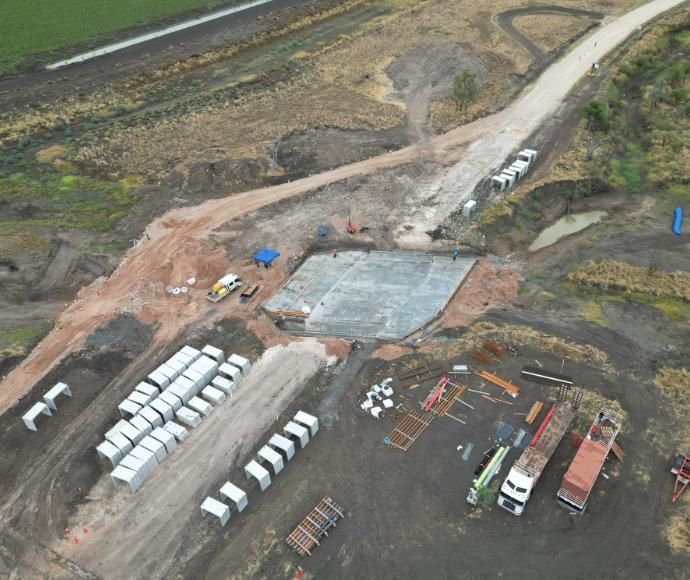 An Aerial View of a Construction Site With Trucks and a Road — Lohman Contracting in Emerald, QLD
