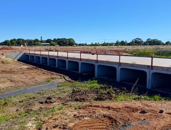 A Bridge is Being Built Over a River in a Field — Lohman Contracting in Emerald, QLD