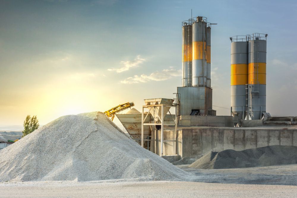 Cement Plant with Silos and Conveyor Loading a Large White Gravel Pile — Lohman Contracting in Emerald, QLD