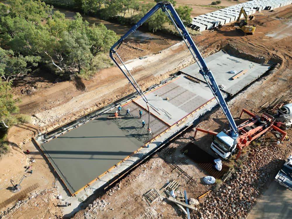 An Aerial View Of A Construction Site With A Crane Pumping Concrete — Lohman Contracting in Emerald, QLD
