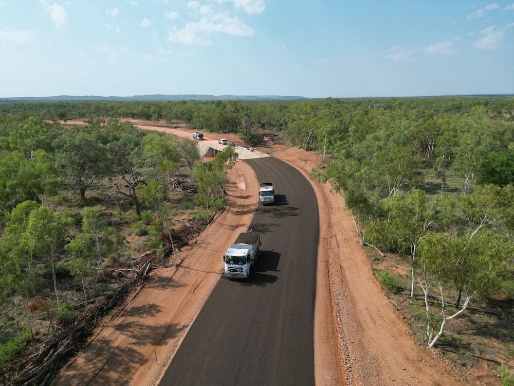 An Aerial View Of A Truck Driving Down A Dirt Road — Lohman Contracting in Emerald, QLD