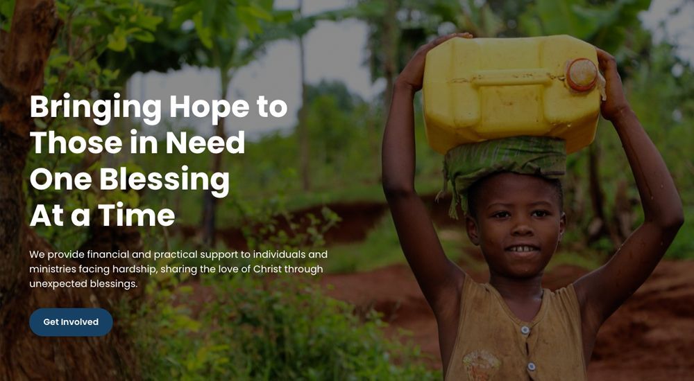 Girl carrying water on head in a rural setting.