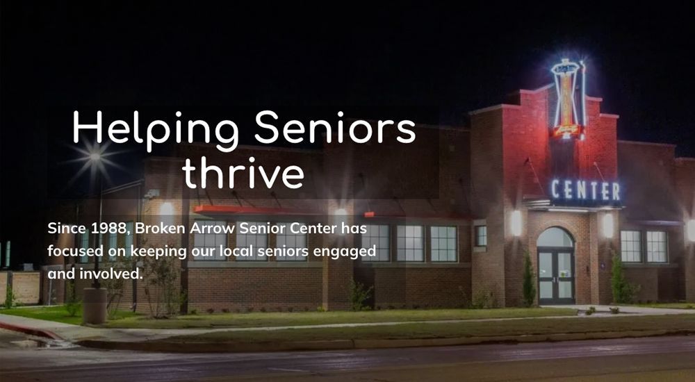 Broken Arrow Senior Center lit up at night; text: 