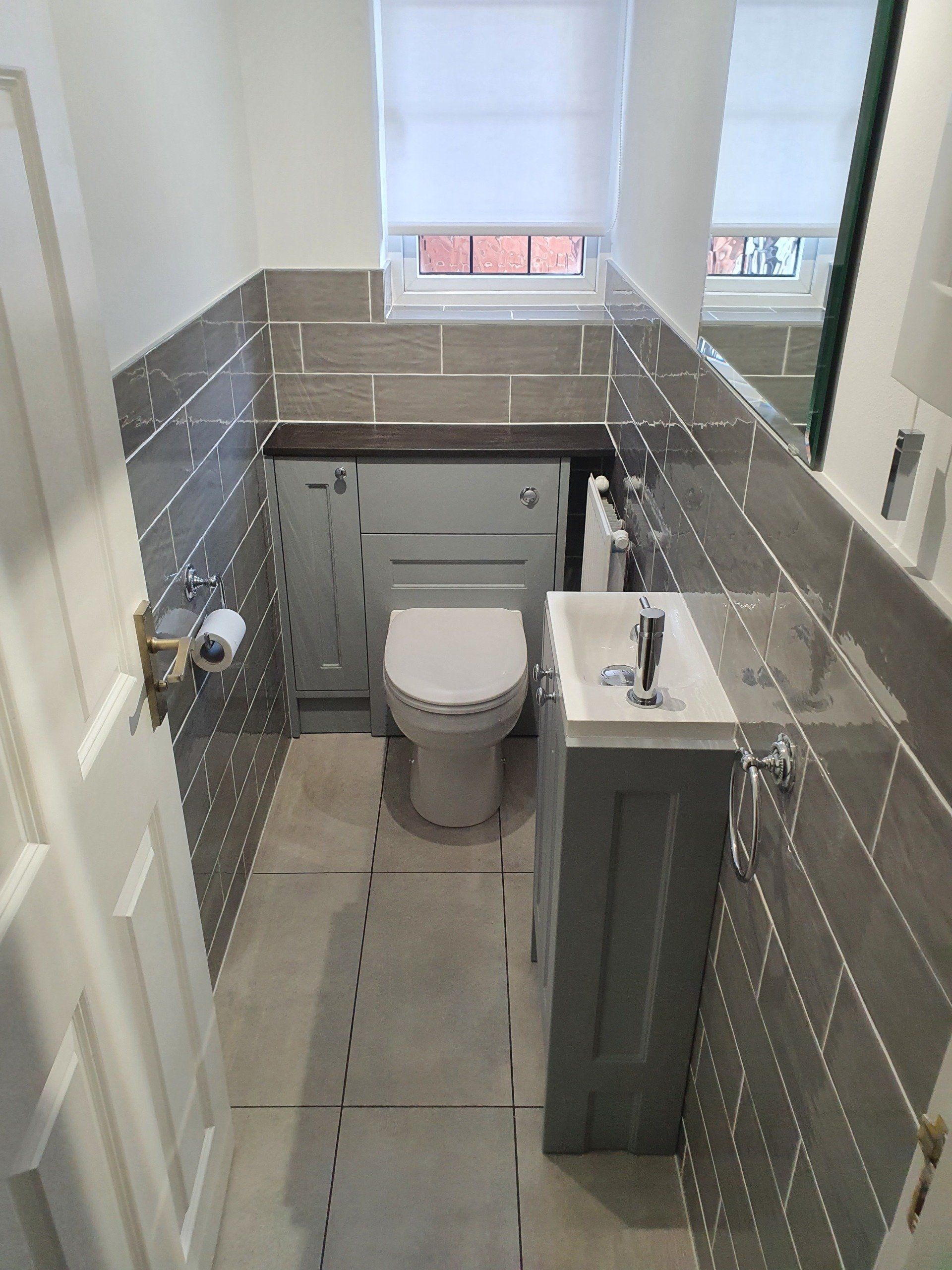 A simple outdate cloakroom refurbished into a modern grey cloakroom with added storage.  We will be returning to do the en-suite soon.