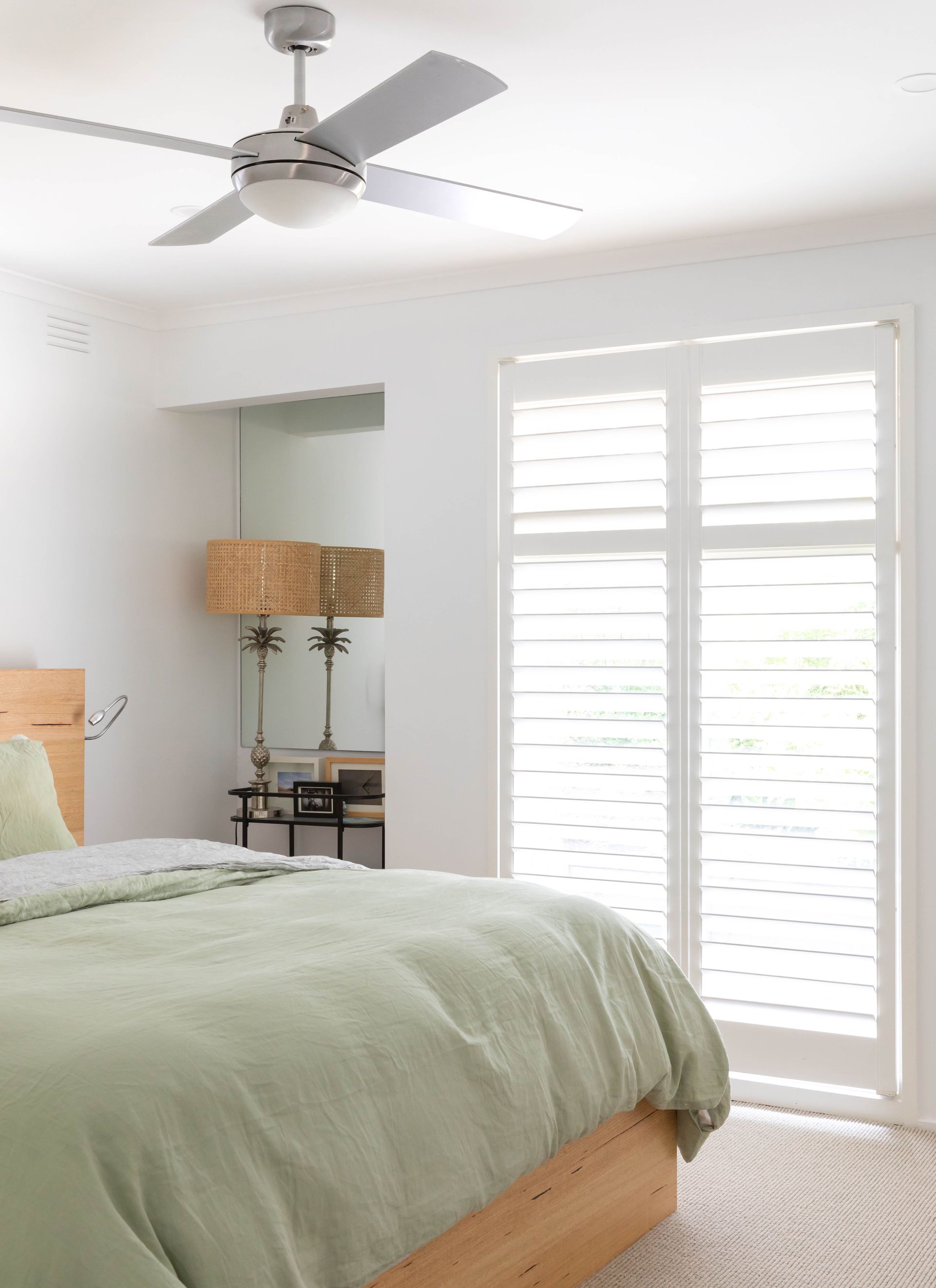 Fabric samples and curtains displayed in a store, showcasing various colors and textures.