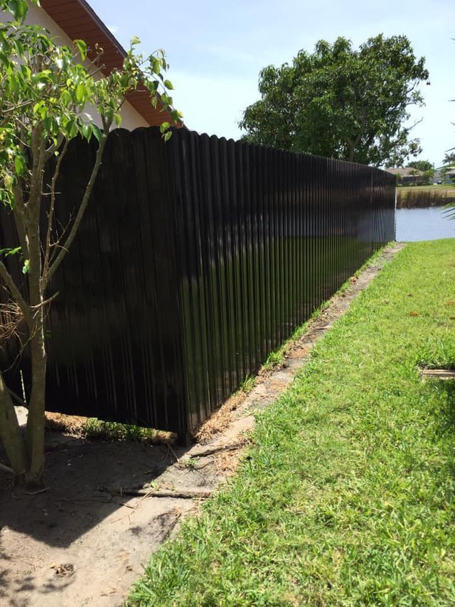 Privacy Fence with Grass — Cape Coral, FL — Global Fence Inc.