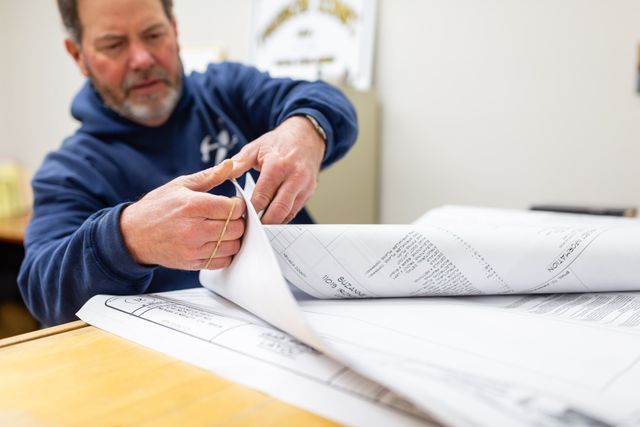 Man Looking On Construction Planning — Grass Valley, CA — Freschi Construction Incorporated