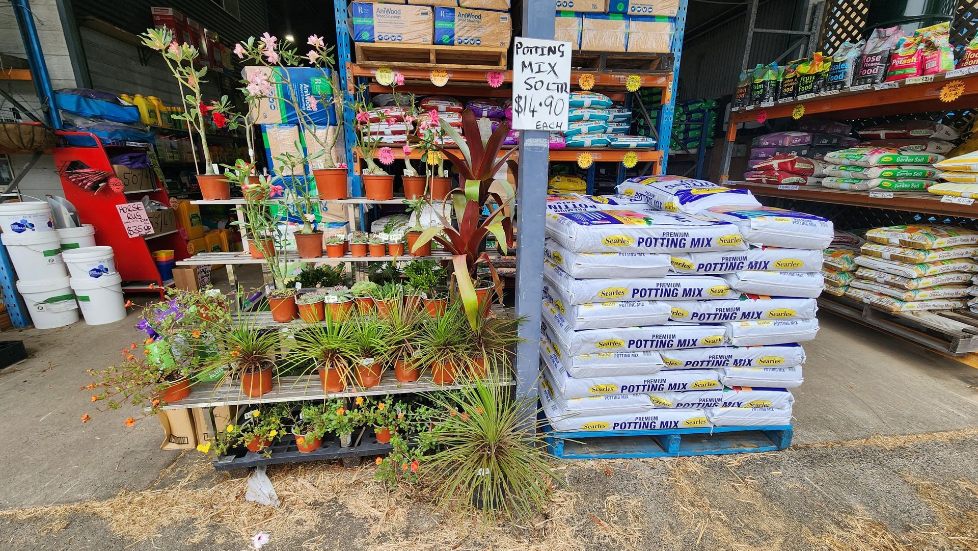 A Bunch Of Bags Of Fertilizer Are Stacked On Top Of Each Other In A Store — Cooroy Produce In Cooroy, QLD