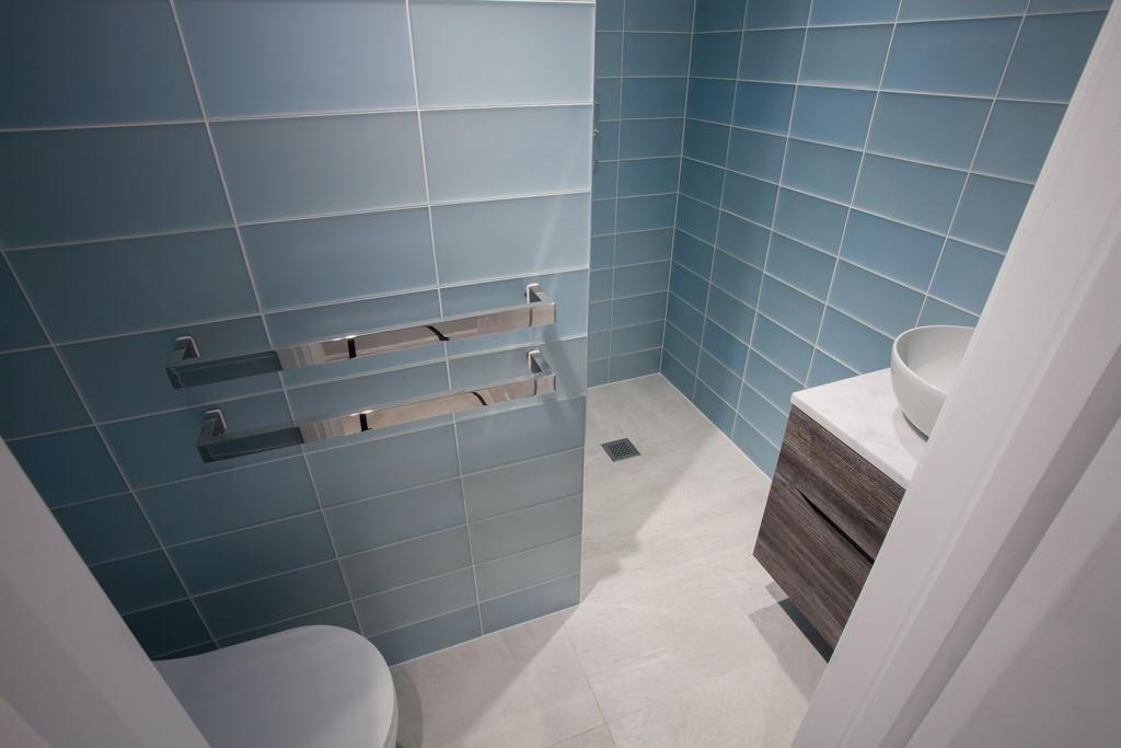 Bathroom with tiled walls