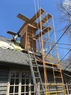 A Chimney Being Repaired — Eagle & East Troy, WI — R & R Fireplace And Chimney