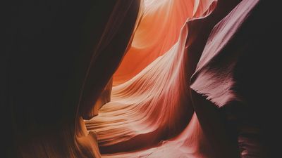 A close up of a canyon with a dark background.