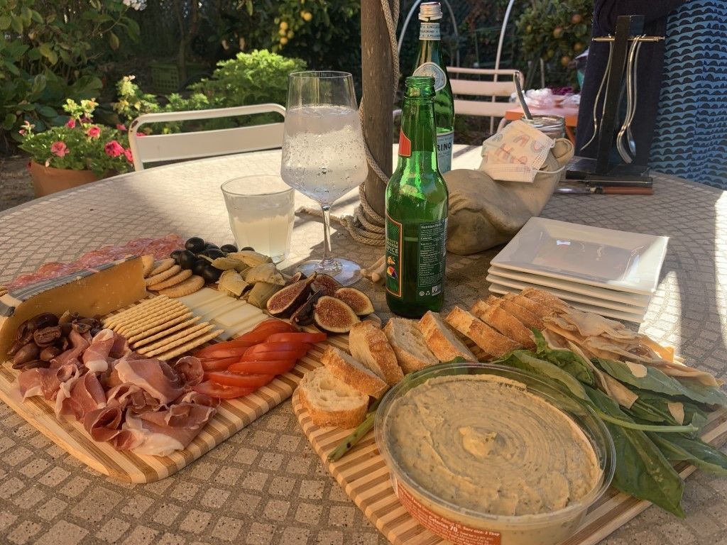 A table topped with a variety of food and drinks.