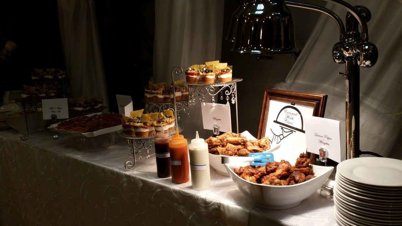 A buffet table with a lot of food on it.
