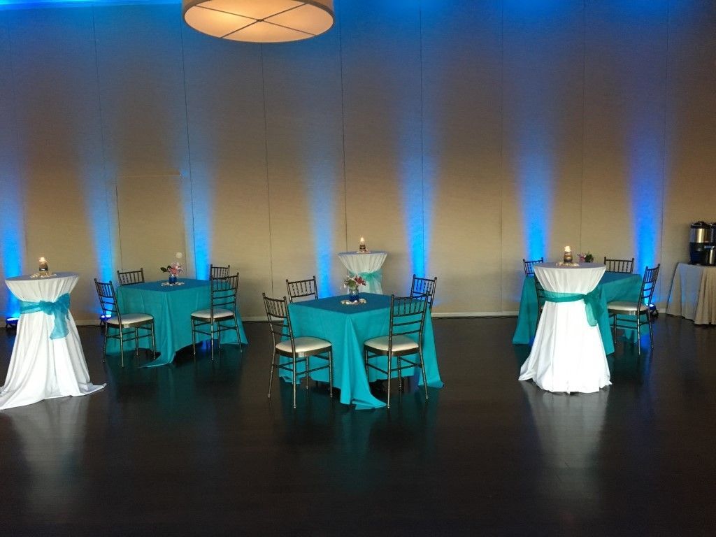 A room with blue and white tables and chairs