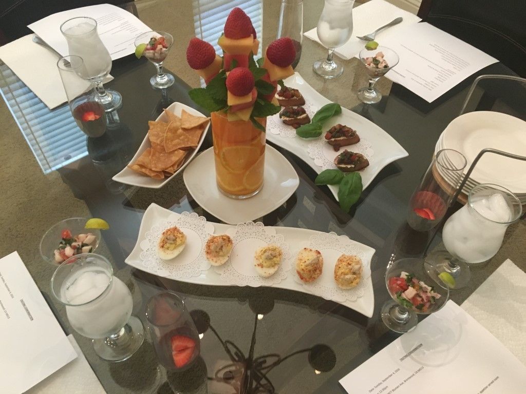A table with plates of food and drinks on it