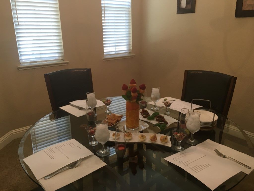 A glass table with a vase of flowers on it
