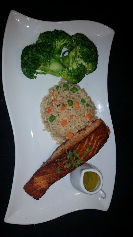A plate of food with broccoli and rice on it