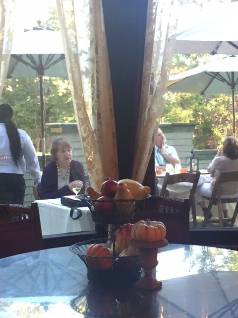 A table with a bowl of fruit on it