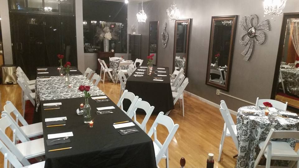 A room with tables and chairs set up for a party