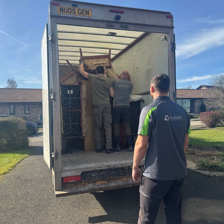 NuGen team loading reusable items into a branded van