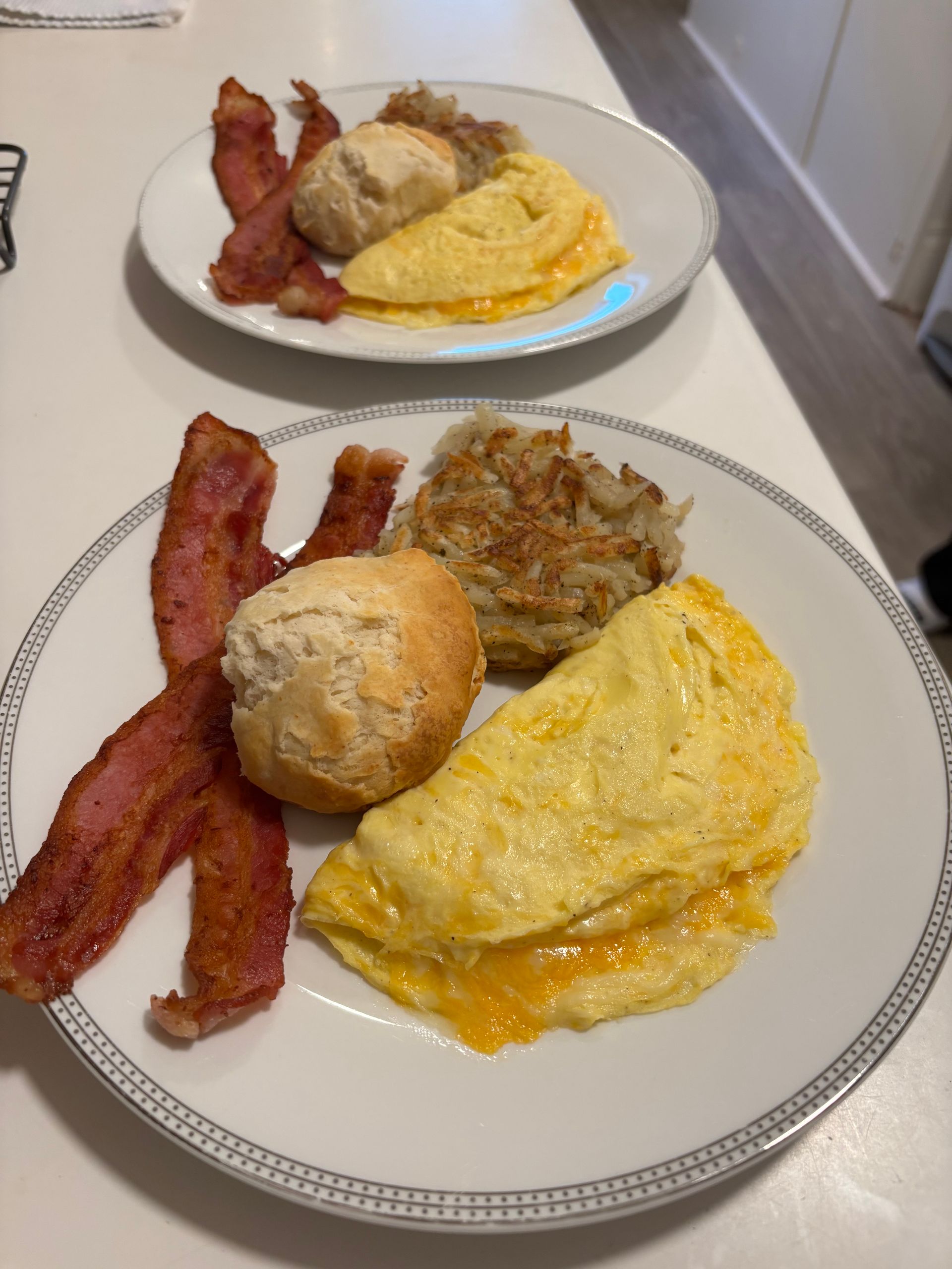 A plate of bananas and apricots next to a plate of brownies