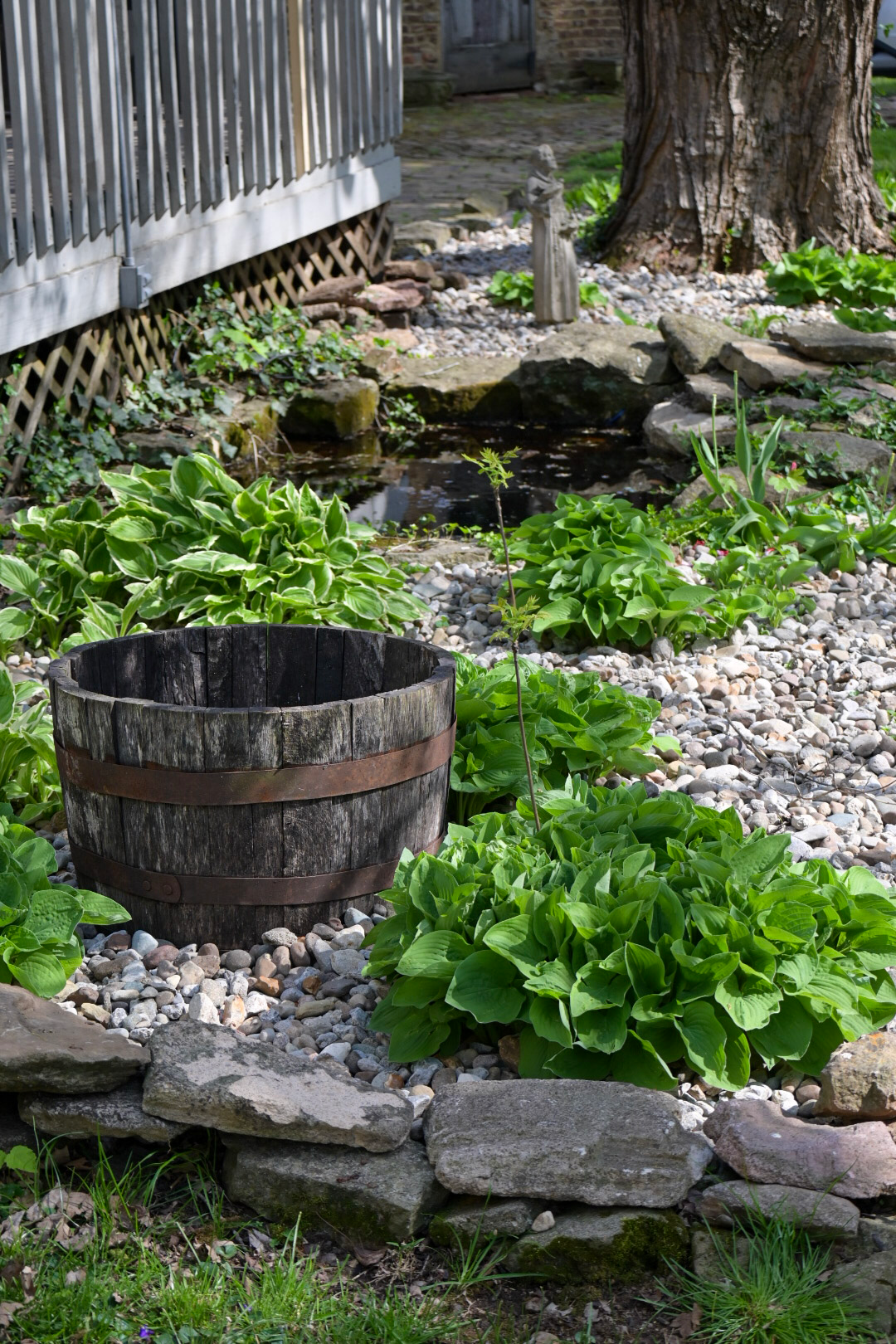 A small bird perched on a branch of a flower.