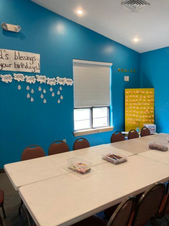 A room with a sign that says it 's blessings your birthday