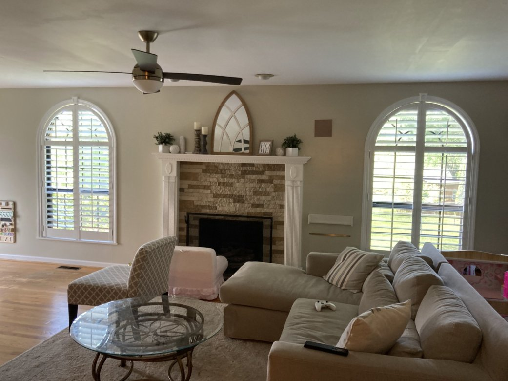 A living room with a couch and a fireplace